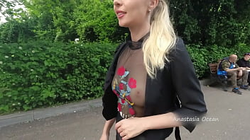 Public walk in semi-transparent t-shirt in apex hour